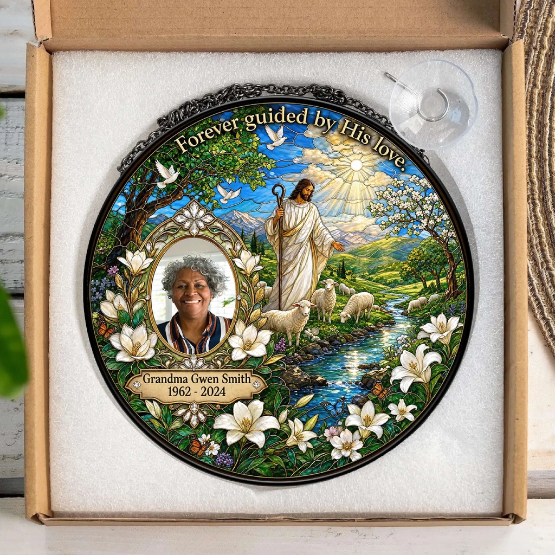 Personalized memorial suncatcher for Grandma Gwen Smith packed in a box, featuring a custom photo, Jesus, and religious theme.