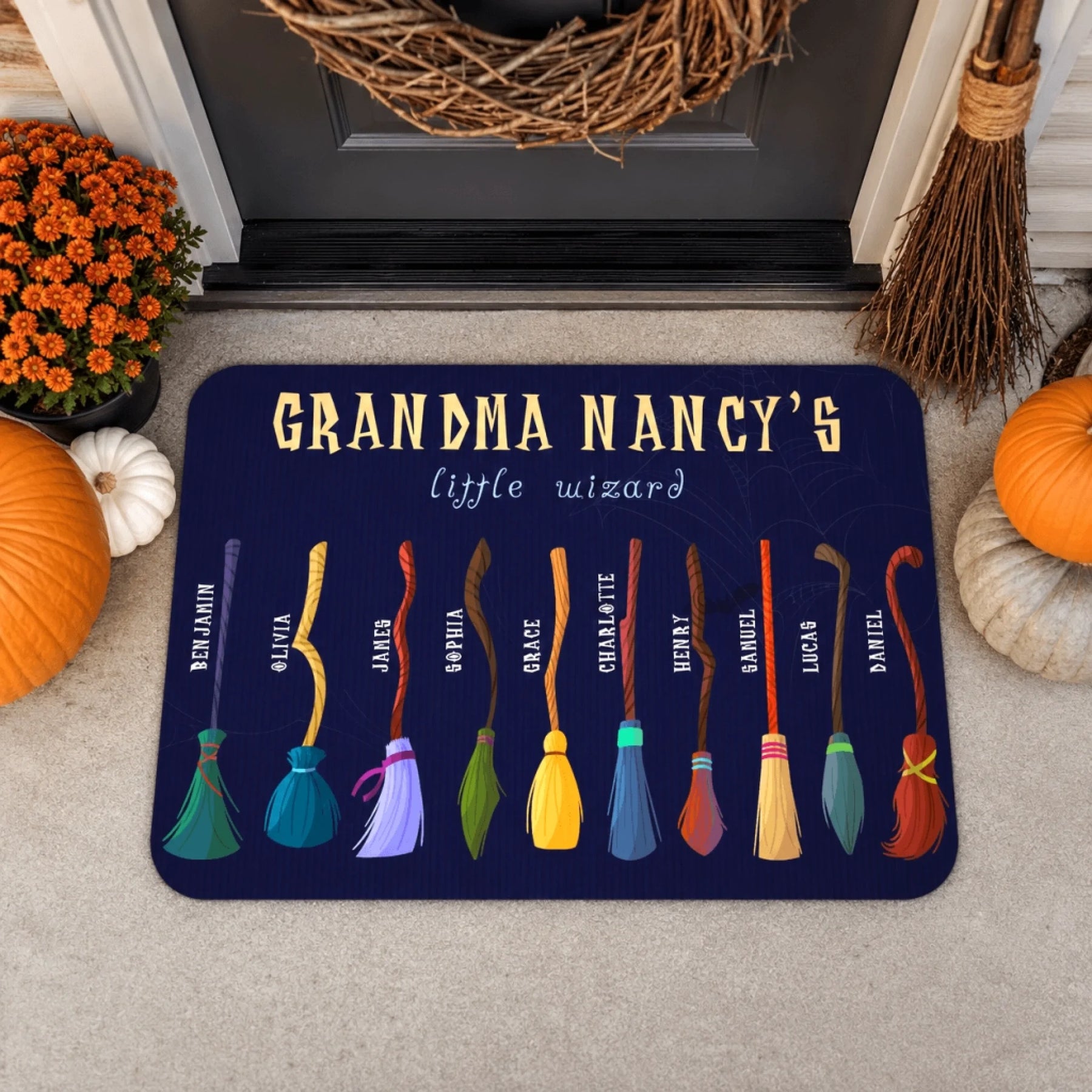 Personalized Grandma Nancys little wizard Halloween welcome mat featuring custom broomstick names for a spooky family themed entry.