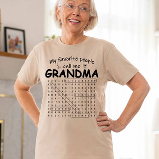 Beige personalized Grandma T-shirt with a word search graphic including custom family member names, perfect grandmother gift.