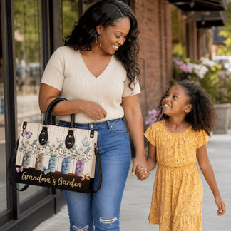 Stylish shoulder bag with Grandma's Garden print featuring personalized daisy mason jars for a family themed gift.