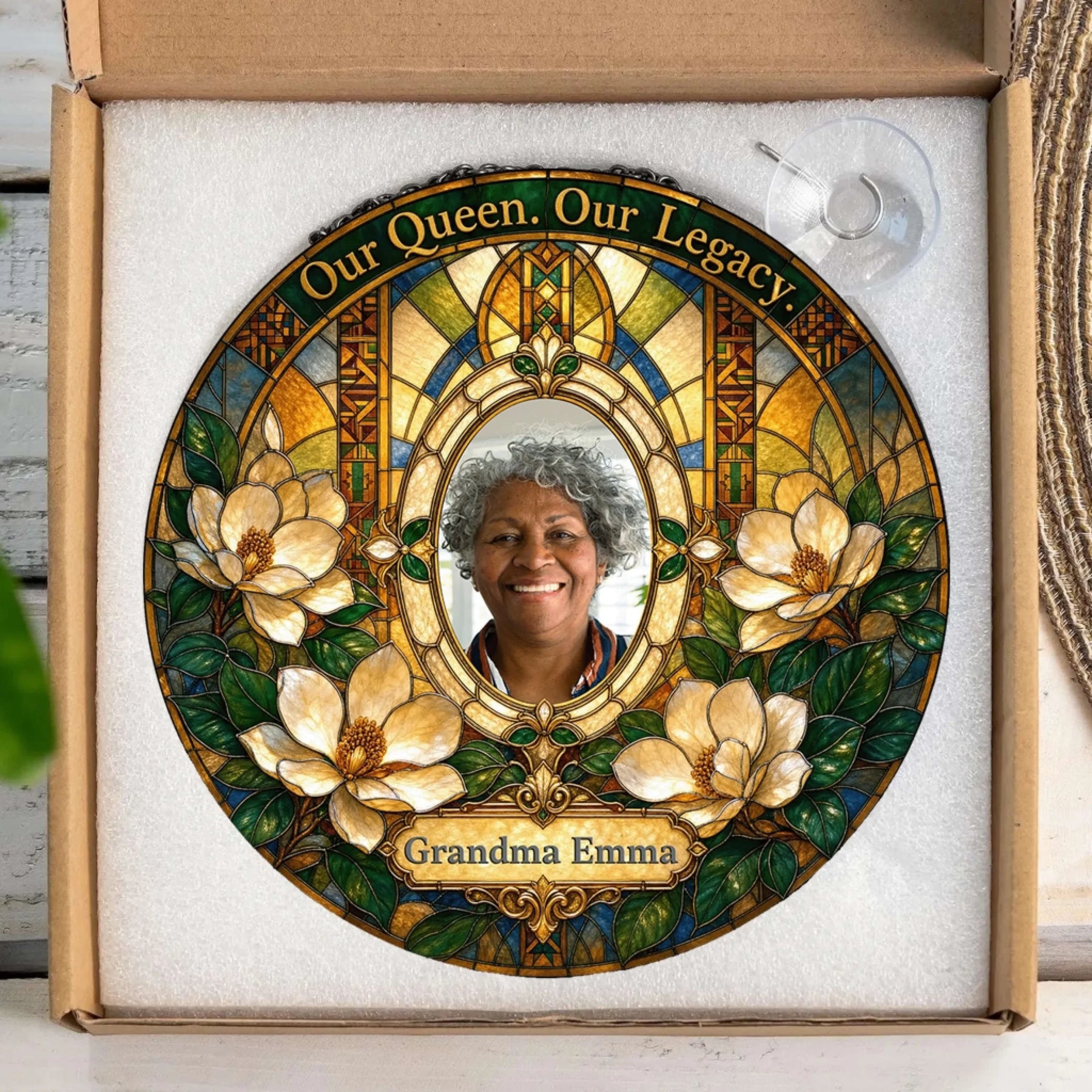 Personalized Grandma Emma memorial stained glass suncatcher inside a gift box with a suction cup hanger included.