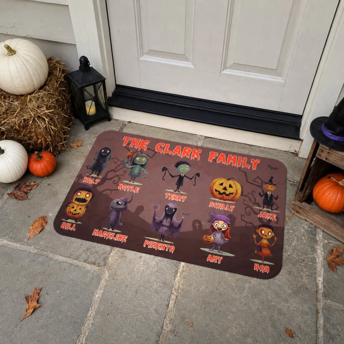 Personalized family Halloween doormat with custom character illustrations and names on a spooky cemetery background.
