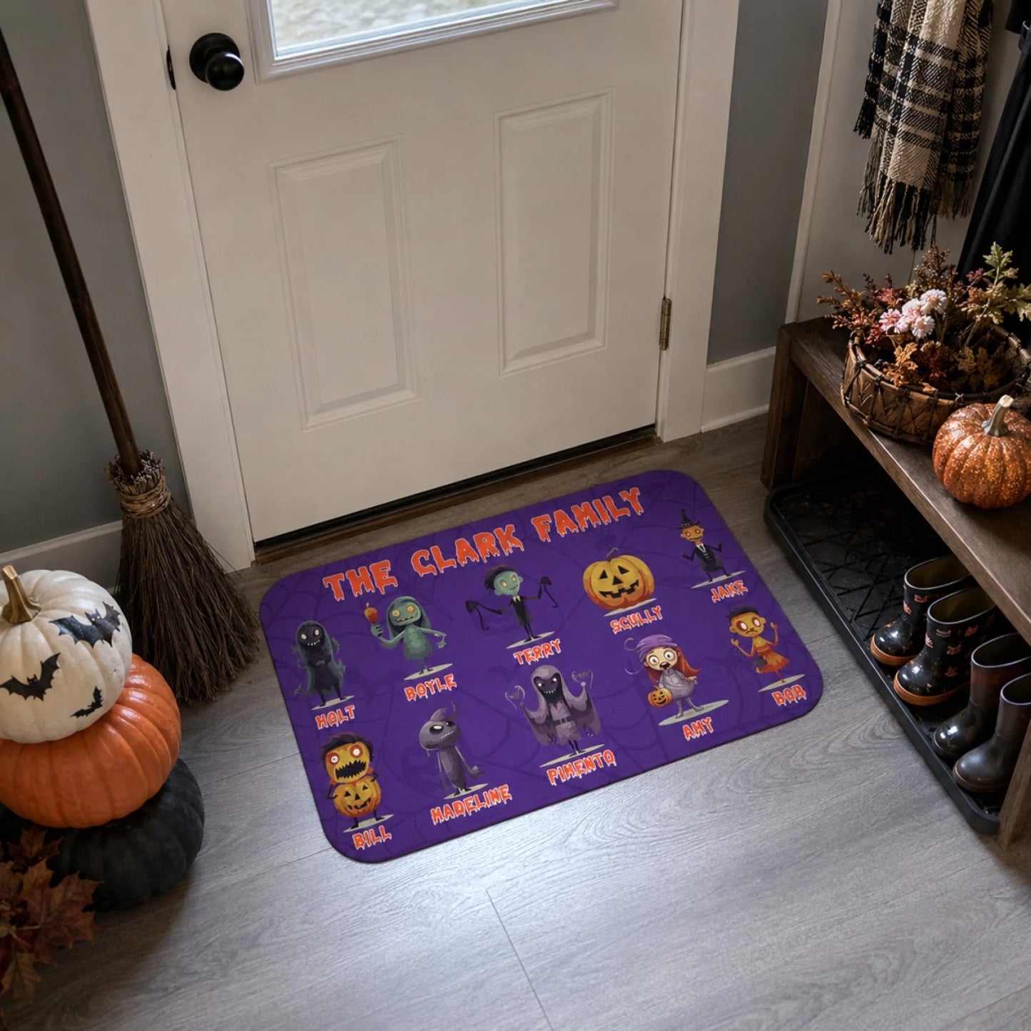 Spooky personalized doormat with cartoon monster characters and custom names for a fun Halloween home entrance.