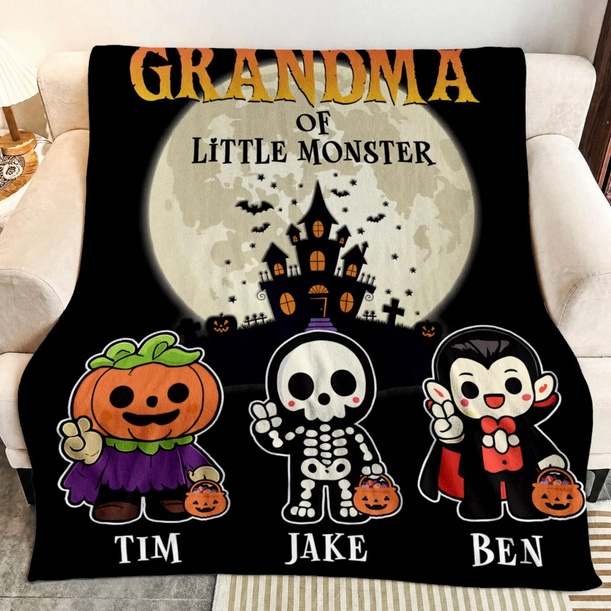 Cozy Halloween throw blanket for Grandma personalized with names Tim Jake and Ben and cute monster characters for the spooky season.