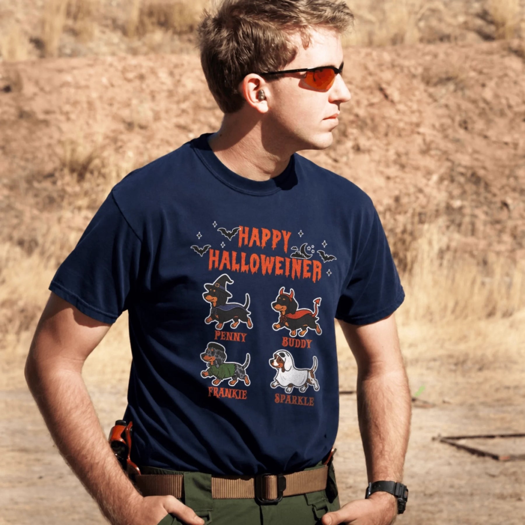 A navy blue personalized dachshund Halloween t-shirt showing four dogs in costumes with custom names for pet lovers.