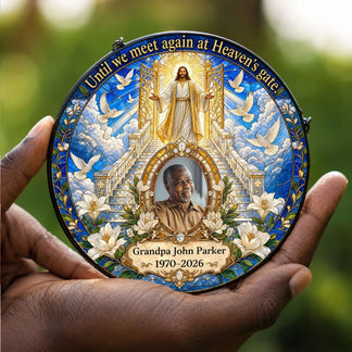 A hand holding a personalized memorial acrylic suncatcher featuring heaven gates and custom photo for a sympathy gift.