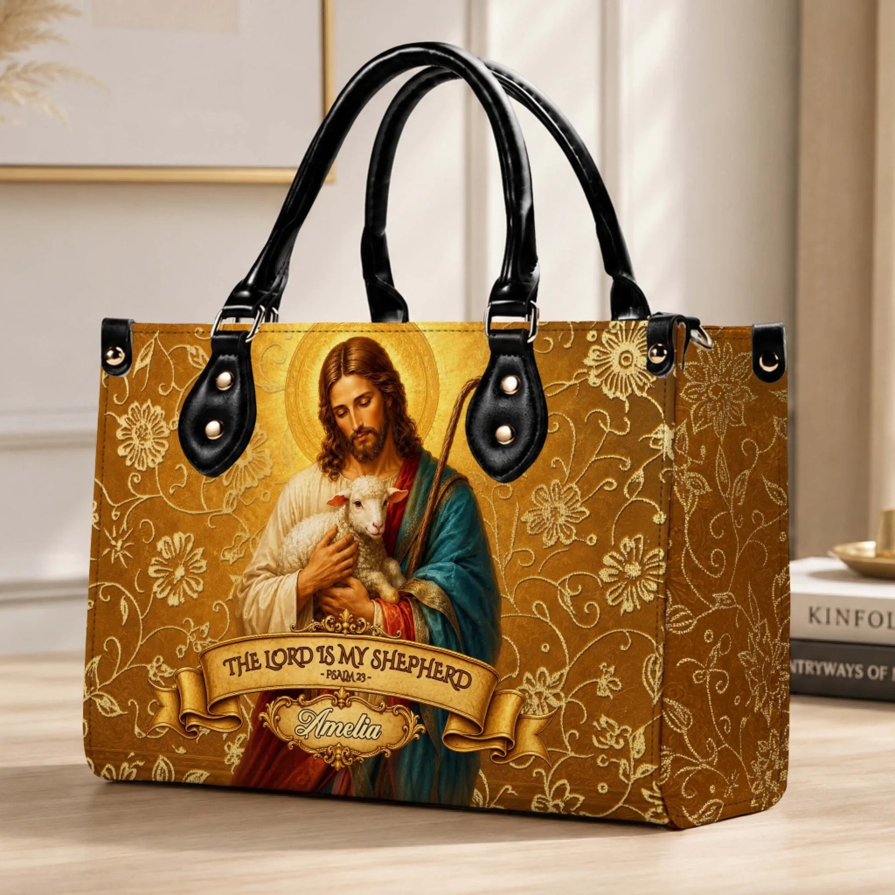 A gold-toned religious shoulder bag displaying a Jesus and lamb illustration with customizable text for a unique gift.