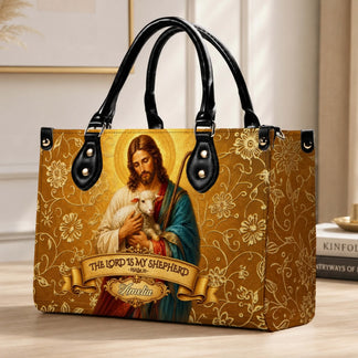 A gold-toned religious shoulder bag displaying a Jesus and lamb illustration with customizable text for a unique gift.