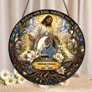 Personalized memorial suncatcher displaying Jesus and a custom photo with the text Walking with Jesus watching over us.