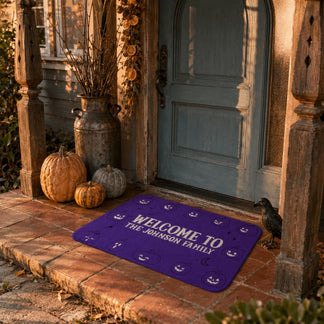 Decorative halloween welcome mat personalized for the johnson family with cute pumpkin faces and purple background