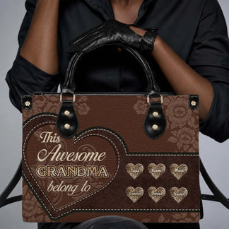 Woman wearing a stylish personalized grandma handbag featuring floral patterns and custom heart-shaped name labels.