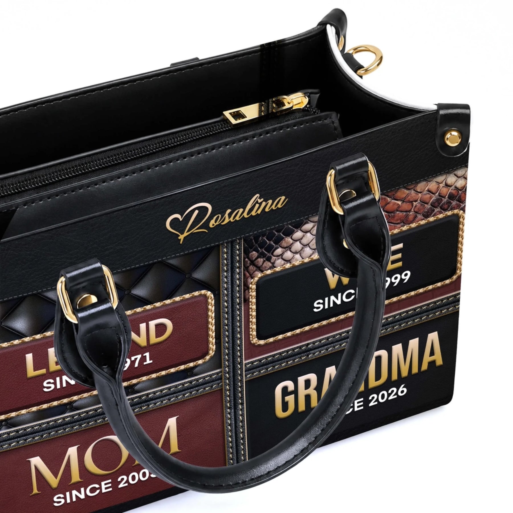 Close up of a premium leather tote bag displaying personalized family milestone years for a thoughtful grandma gift.