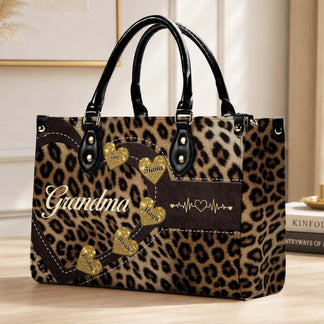 Personalized leopard print handbag for grandma with custom glitter heart name tags and a heart monitor graphic.