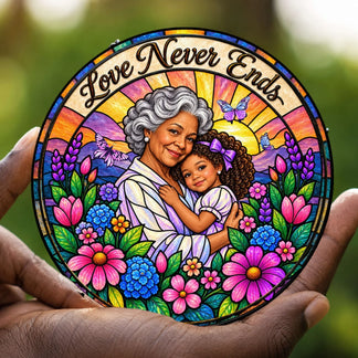 Handheld personalized stained glass suncatcher featuring a grandmother and granddaughter with floral designs.