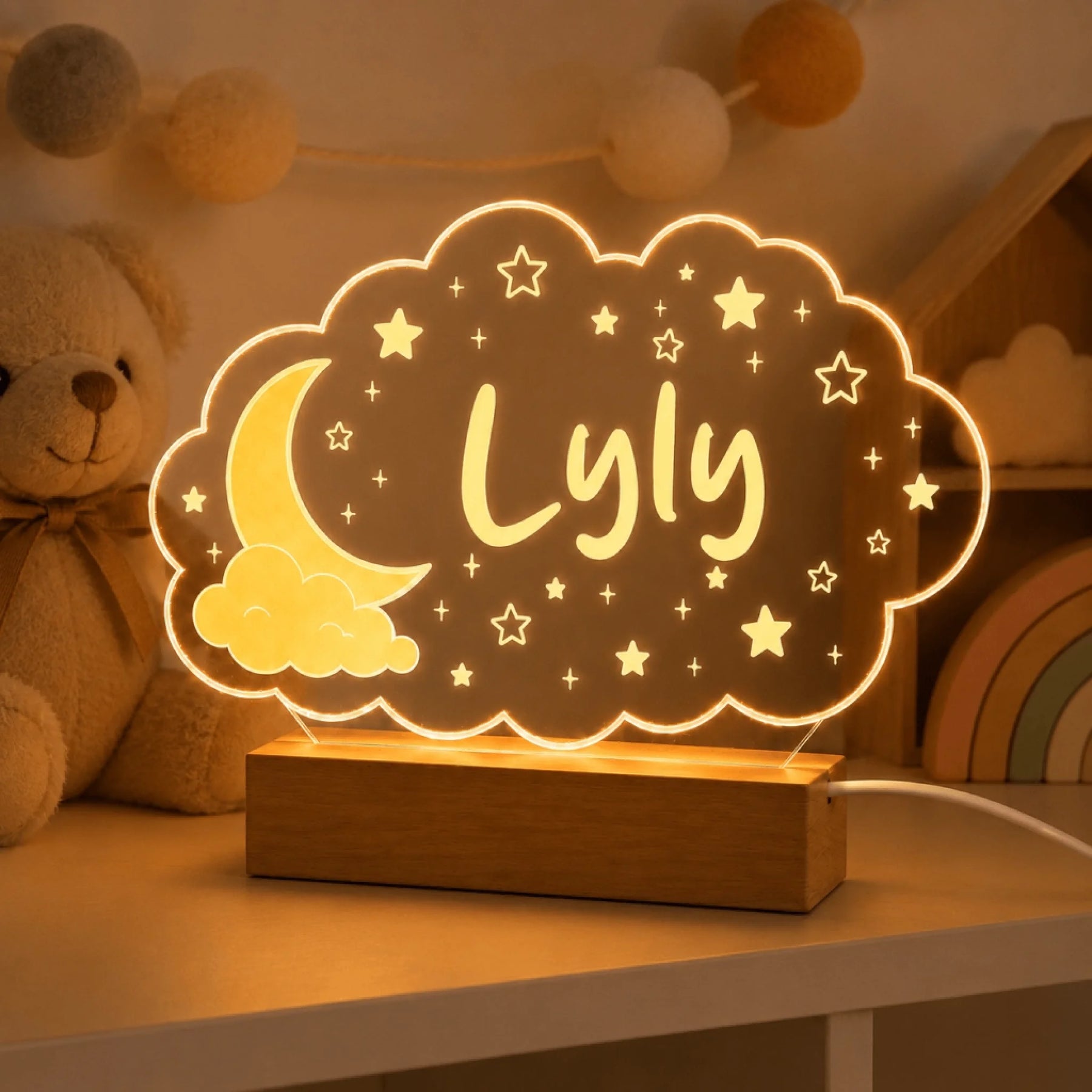 Personalized LED night light in a cloud design featuring the name Lyly, a sweet gift for a nursery or bedroom.