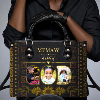 A person holding a personalized Memaw handbag with custom family photos and gold floral artwork for a gift