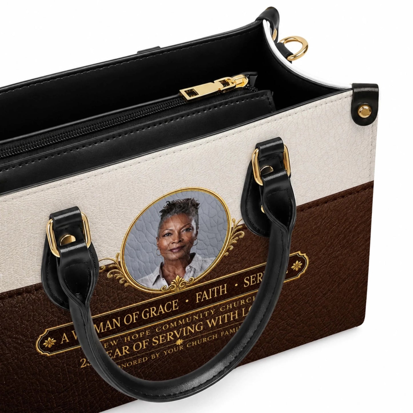 Close up of a personalized leather handbag featuring a custom portrait photo and meaningful church anniversary quote.