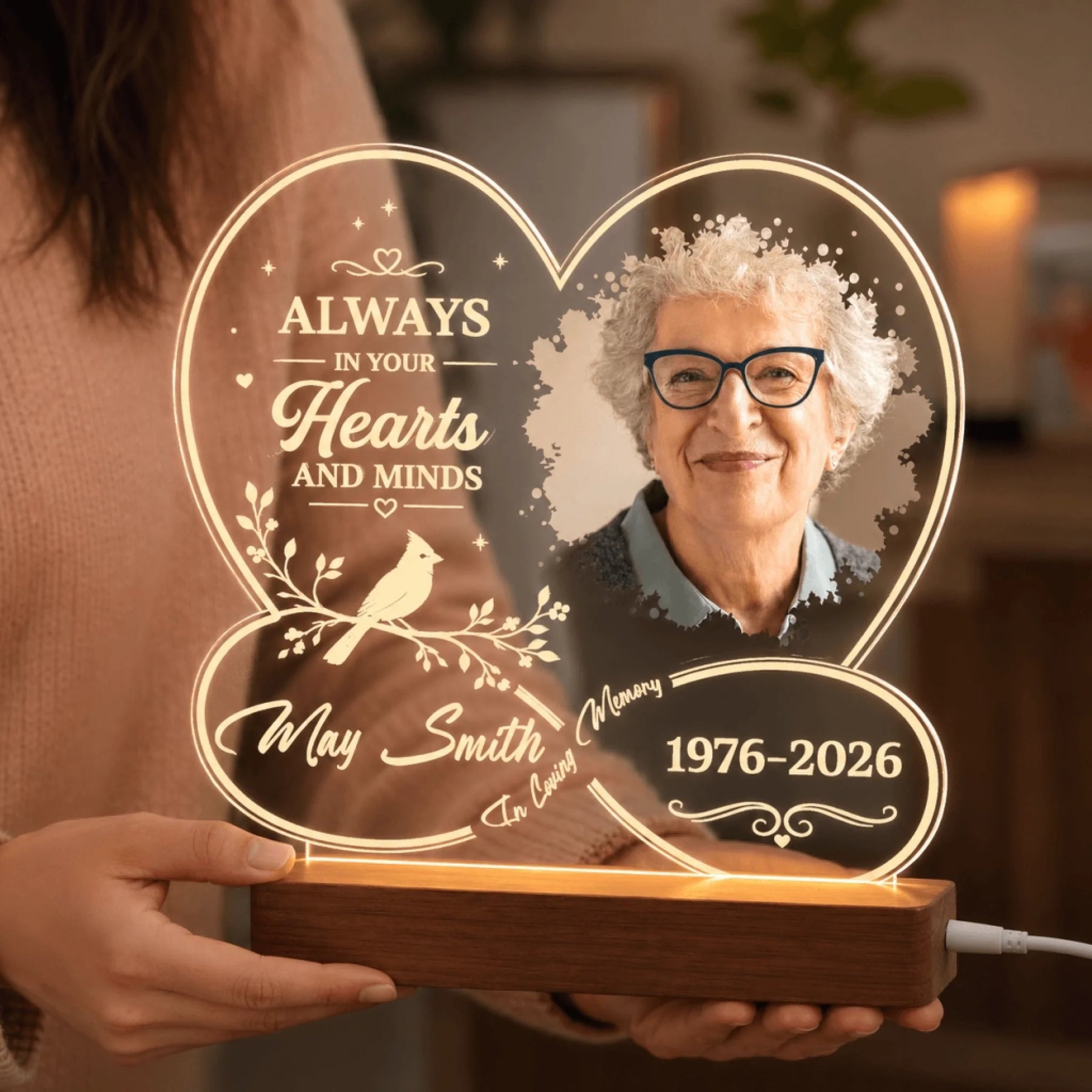 Handheld personalized heart-shaped LED memorial plaque featuring a custom photo and loving tribute text.