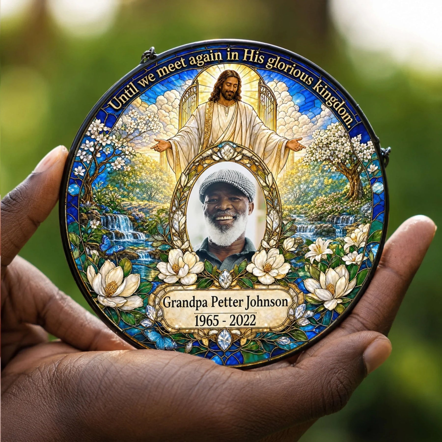 Handheld personalized memorial acrylic suncatcher, featuring religious art and custom photo as a sympathy keepsake.