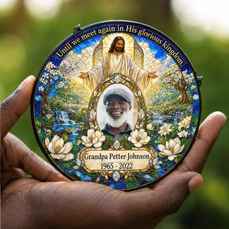 Handheld personalized memorial acrylic suncatcher, featuring religious art and custom photo as a sympathy keepsake.