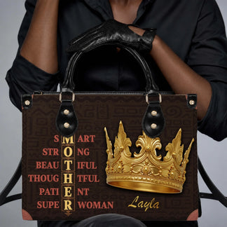 Woman holding a custom mother-themed tote bag with a golden crown graphic and the name Layla, perfect for Mother's Day.