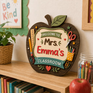 Decorative apple shaped classroom door sign personalized for Mrs Emma ideal as a school year end teacher gift.