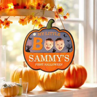 Decorative Sammy first Halloween pumpkin sign featuring two baby photos and spooky Halloween themed graphic elements.