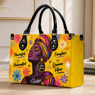 Fashionable handbag displaying a black woman art design with floral patterns and a custom name personalization.