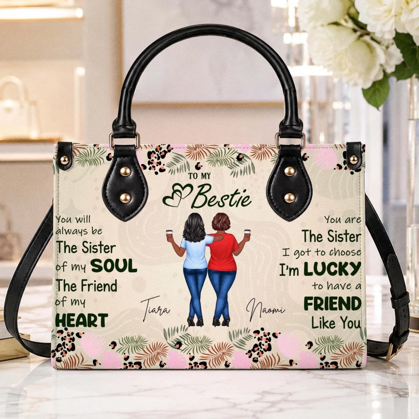 Elegant personalized best friend handbag with an illustration of two friends, custom names, and floral accents.