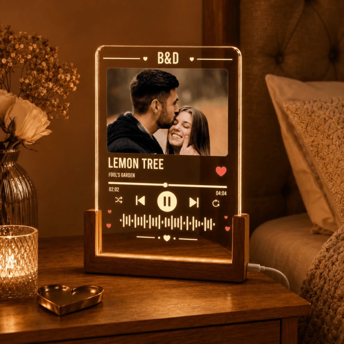 Illuminated custom music plaque for nightstand, featuring photo of a couple in warm amber glow.