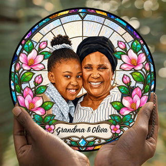 Customized stained glass suncatcher held in hands, showcasing a photo of a woman and child with elegant pink floral stained glass accents.