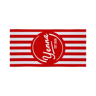 A vibrant red and white striped beach towel personalized with the name Yenna and EST 2026 in a central graphic.