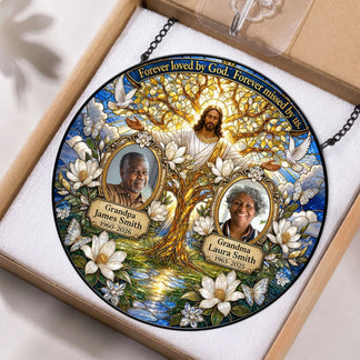Packaged custom memorial suncatcher with Jesus, doves, and personalized photos honoring loved ones with dates.