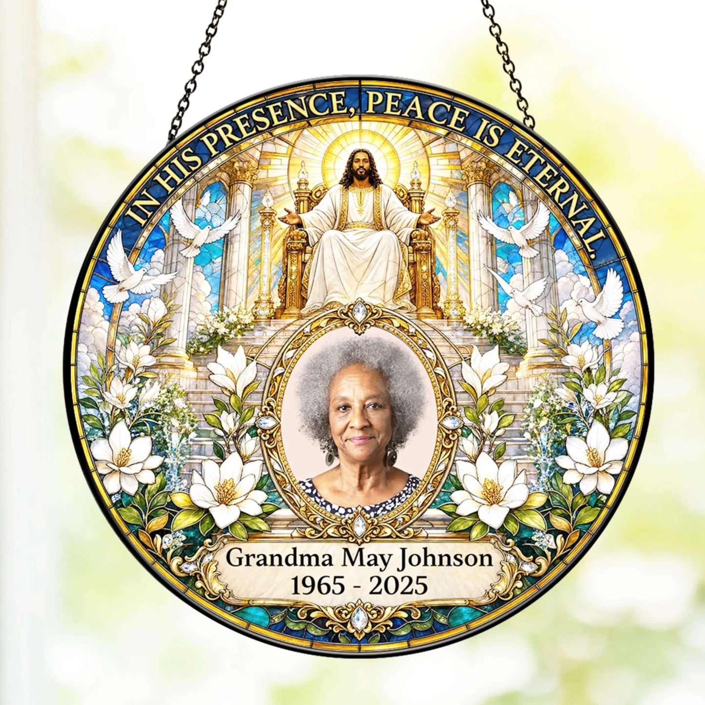 Stained glass style religious memorial suncatcher customized with a photo of a woman and her memorial birth and death dates.