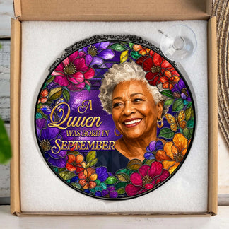 Custom September birthday queen acrylic suncatcher gift shown inside protective packaging with suction cup.
