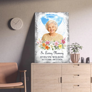 Custom sympathy wall canvas with angel wings and floral accents, designed as a beautiful memorial gift for a loss.