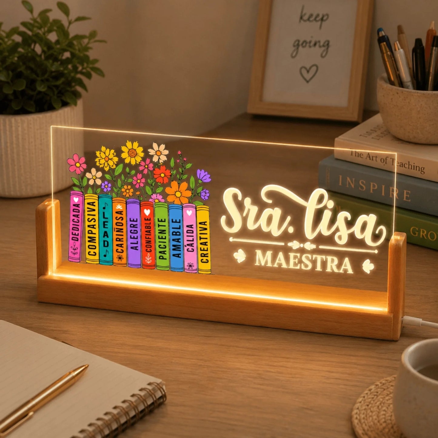 Personalized teacher LED sign on a wooden base with Sra Lisa and floral books in a cozy desk setting