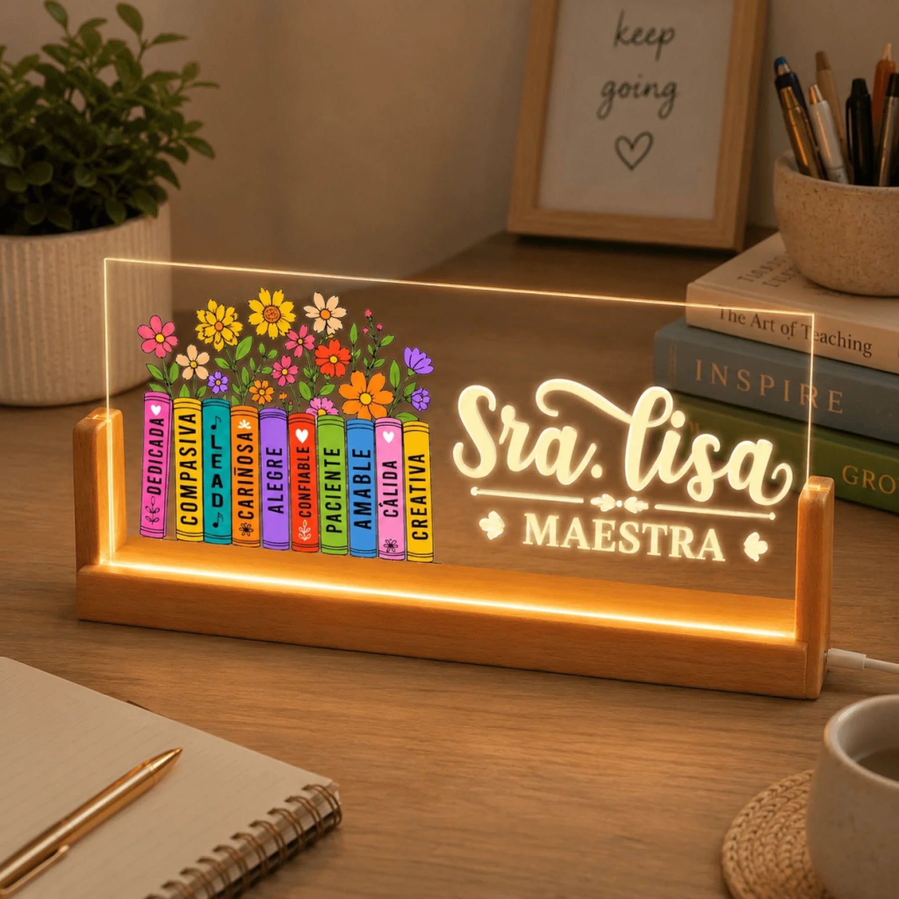 Personalized teacher LED sign on a wooden base with Sra Lisa and floral books in a cozy desk setting