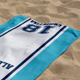 Personalized beach towel for volleyball player Christina with number 18 and Allstars text on sandy beach background