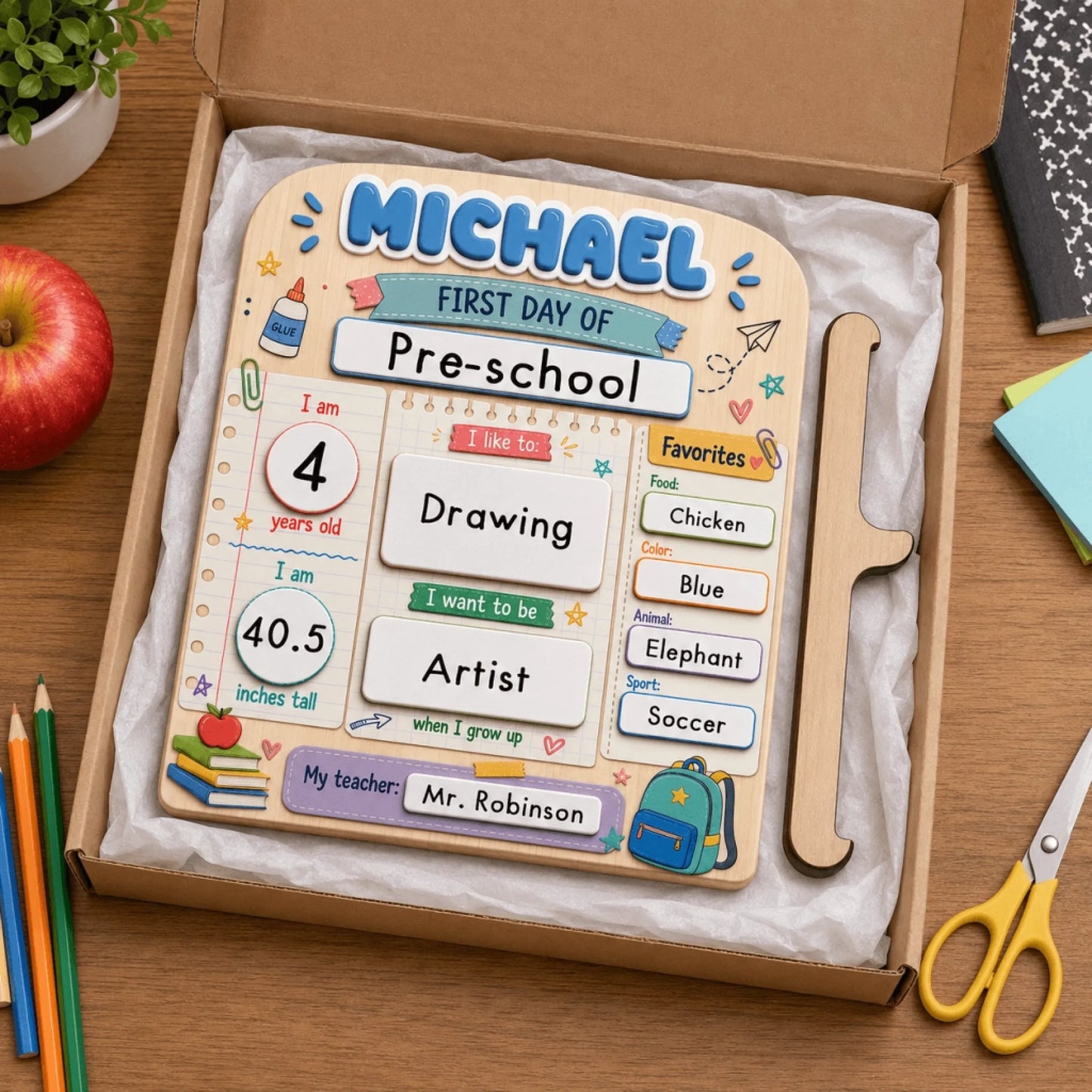 Personalized wooden first day of preschool sign displayed inside a gift box with school supplies as a perfect gift.