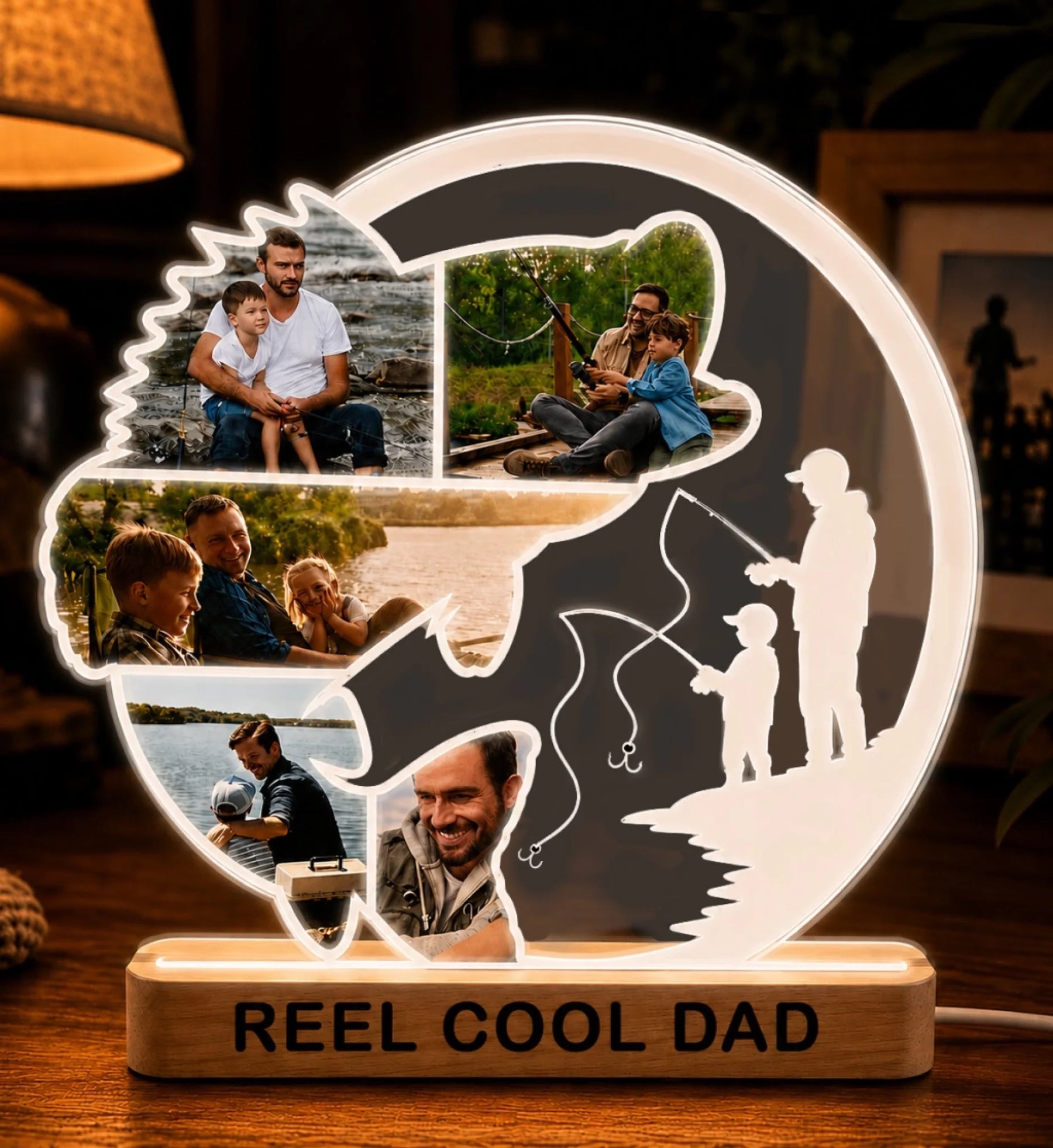 Decorative lamp with family photos and 'Reel Cool Dad' text on a wooden base.