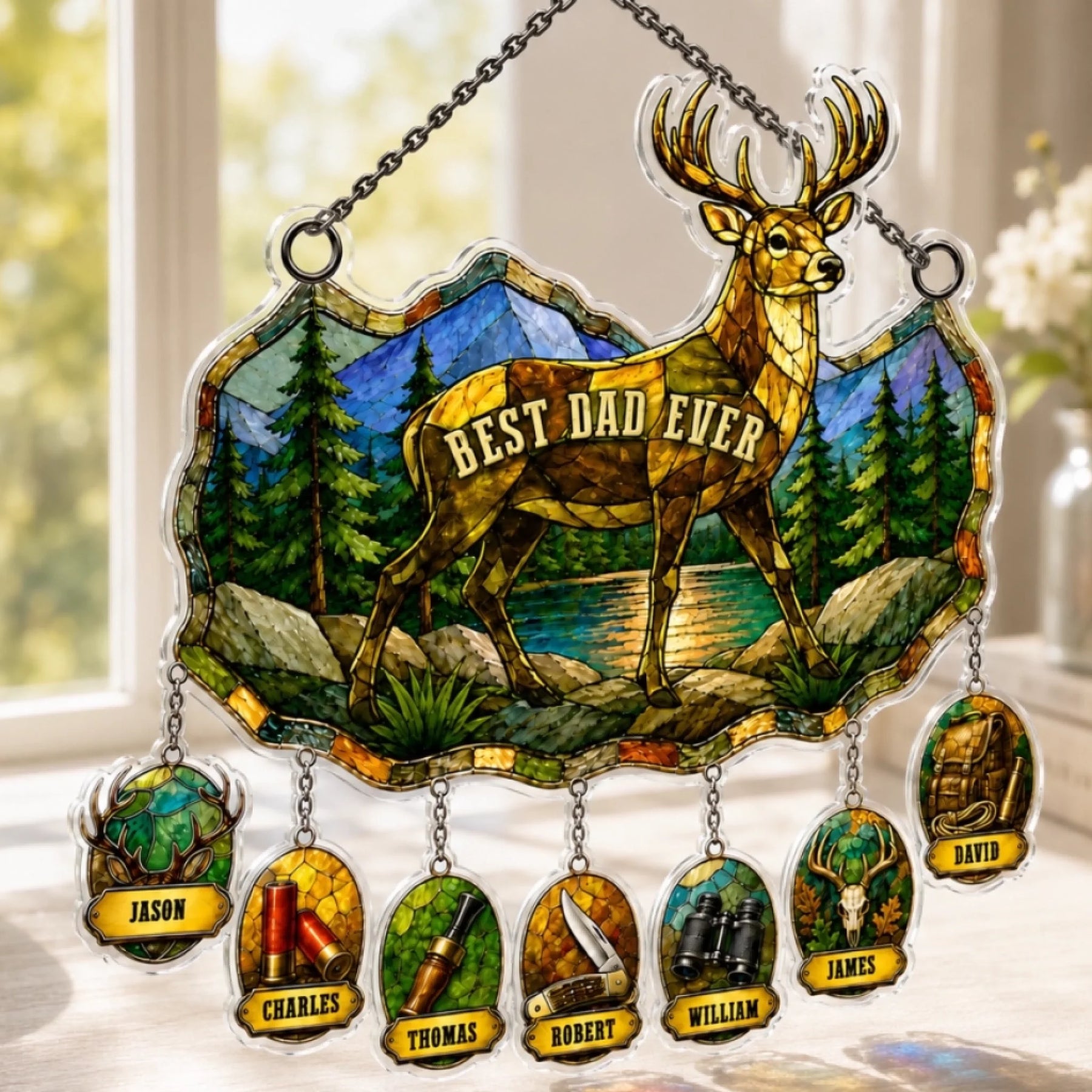 Custom kids names suncatcher displayed in window with sunlight shining through