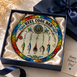 Colorful 'Reel Cool Dad' fishing-themed decorative plate in a box with a blue ribbon.