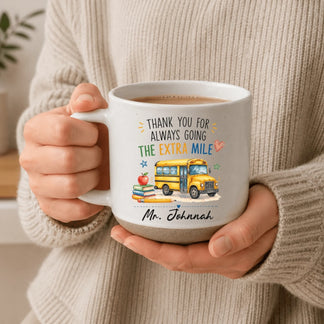 Close-up of custom school bus driver coffee mug with personalized name