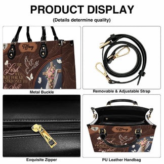 Product feature display of religious floral cross handbag showing zipper strap and high quality leather material