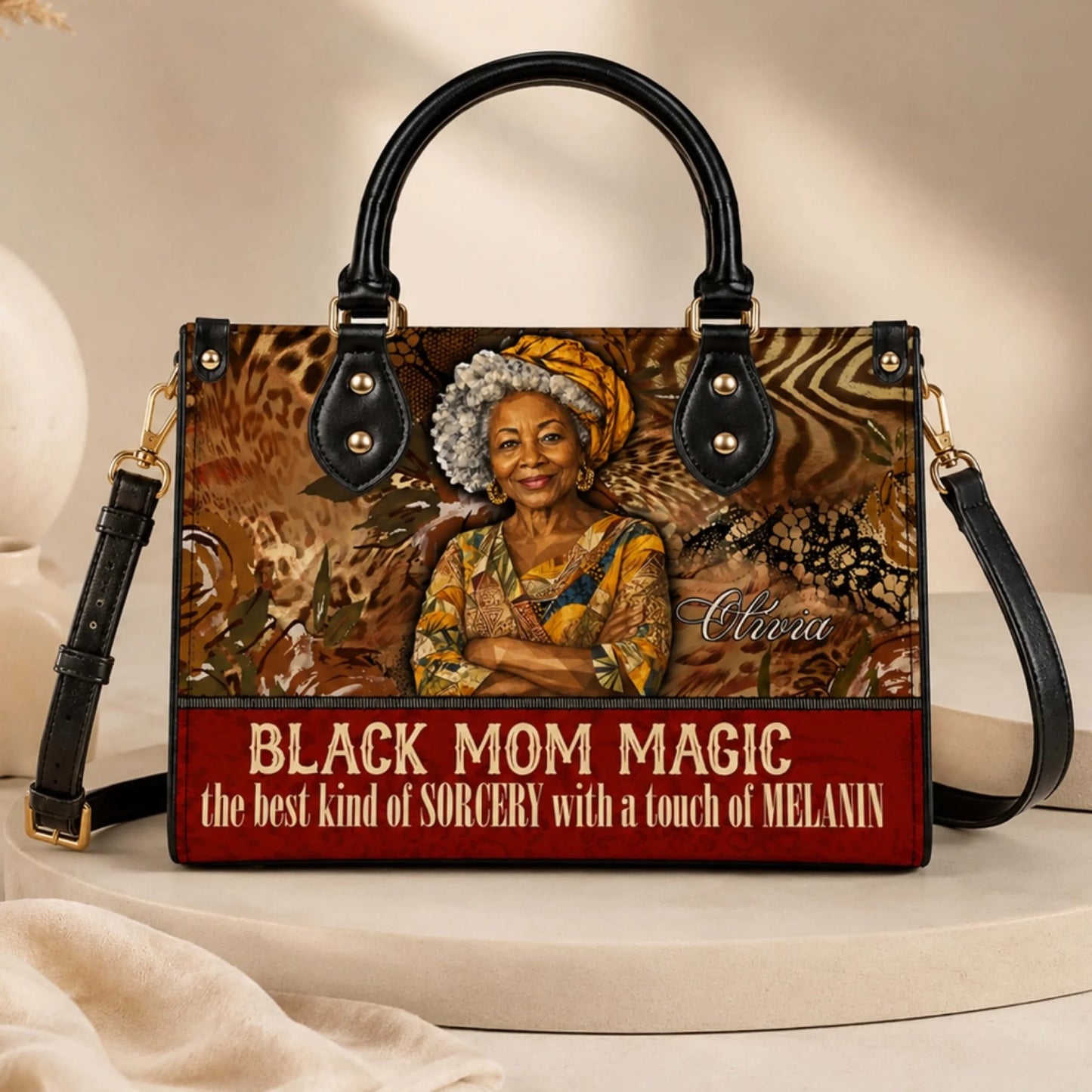 Front view of a personalized Black Mom Magic shoulder bag featuring custom name text as a thoughtful gift