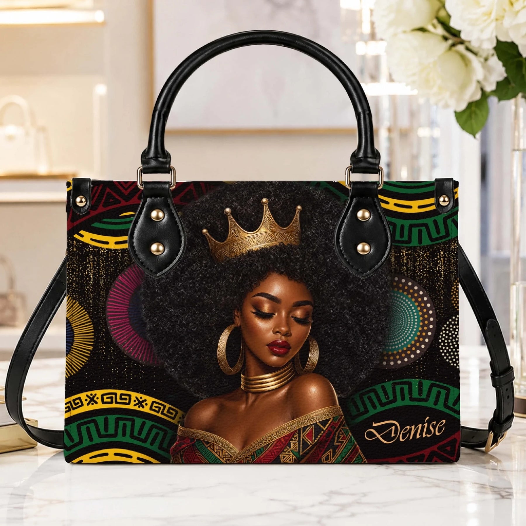 Stylish PU leather handbag featuring a beautiful Black queen illustration with a crown and African inspired patterns.