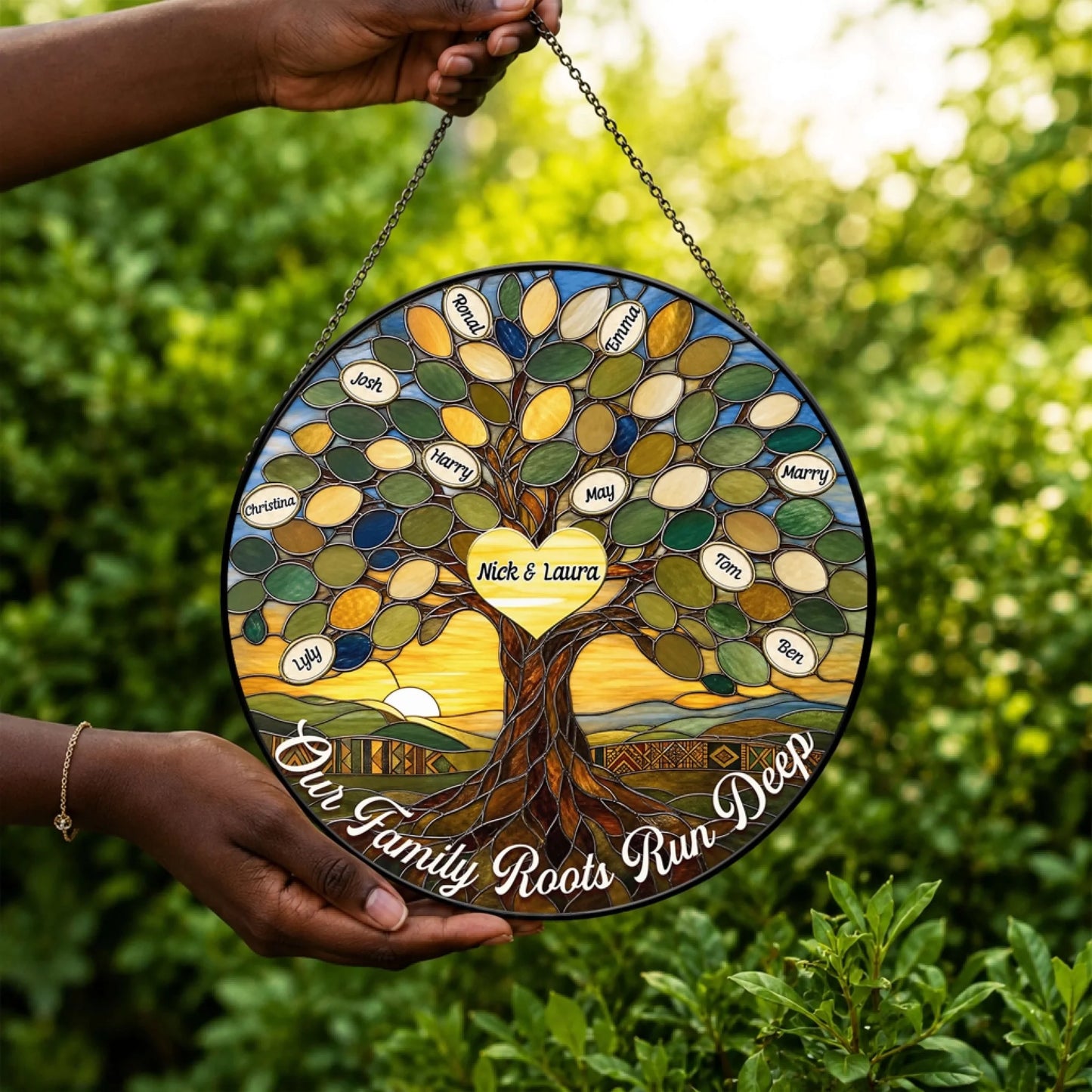 Decorative round stained glass window hanging featuring a custom family tree design with names and a heart center inscribed with Nick and Laura.
