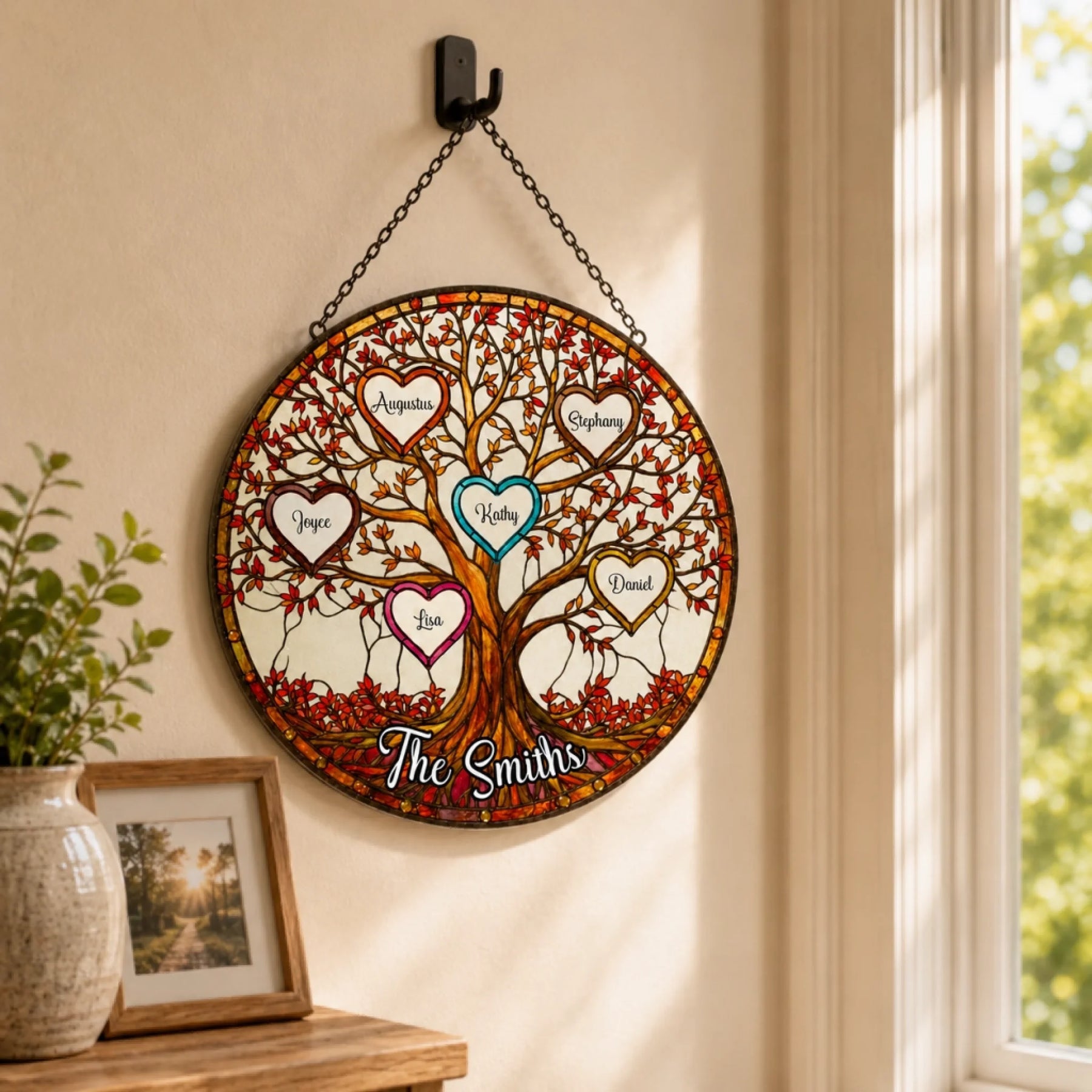 Round stained glass suncatcher with tree of life design and personalized heart frames for a family wall decor gift.