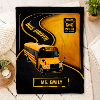 A personalized bus driver throw blanket with school bus design and Ms. Emily text, ideal gift for bus drivers.